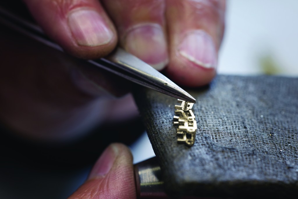 Jeweler setting a stone at the bench